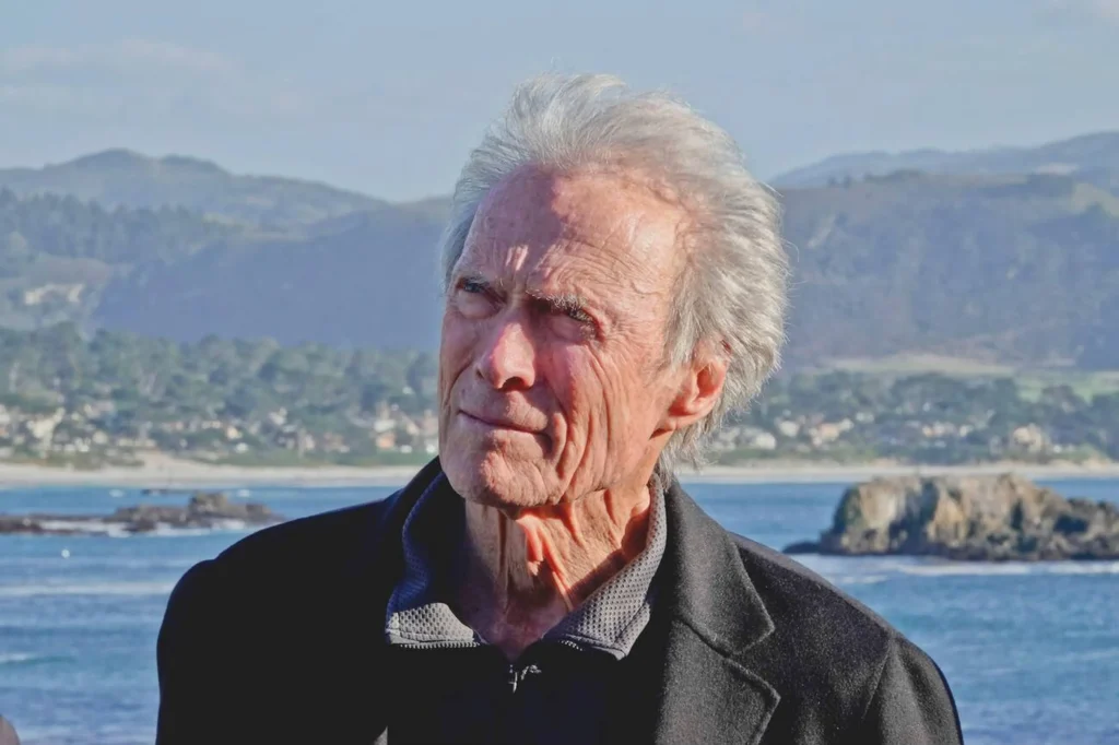 Portrait of Clint Eastwood smiling, reflecting his enduring legacy in Hollywood.